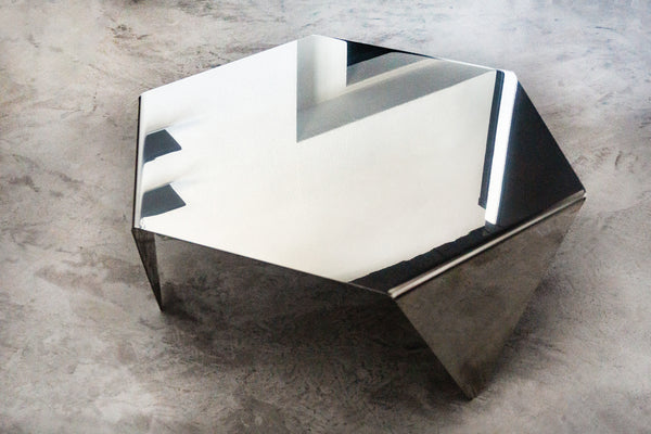 Polished steel side table
